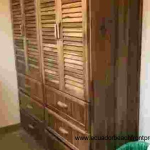 linen closet/armoire in the ensuite bath