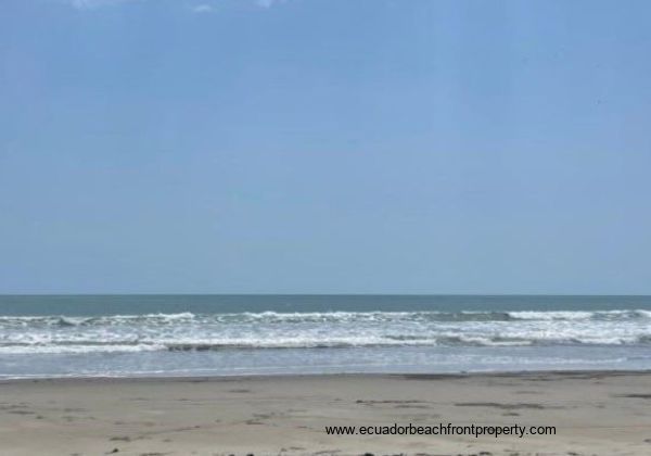 Sandy beach out front with warm, swimmable water