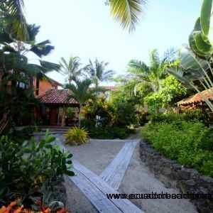 Tropical landscaping and bamboo pathways separating the the main house from the guest house