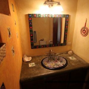 Downstairs shared bath with custom ceramic sink