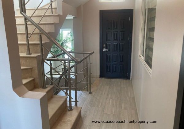 Doorway to balcony that overlooks the backyard patio