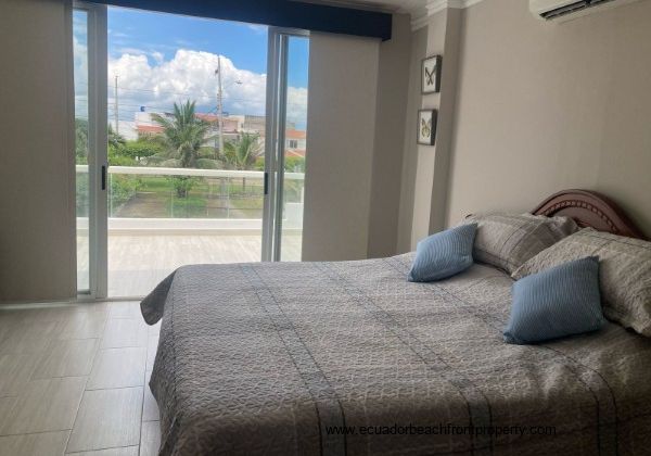 master bedroom has sliding doors to the ocean view balcony