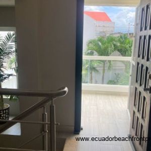Doorway to balcony that overlooks the backyard patio