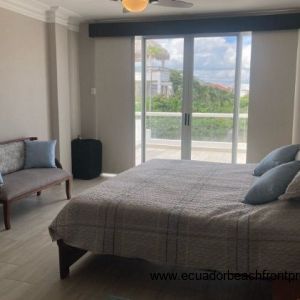 master bedroom has sliding doors to the ocean view balcony