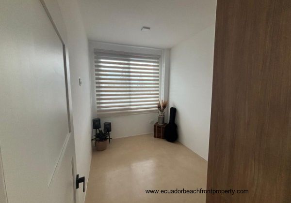 2nd floor, Third bedroom with window treatments and wardrobe 