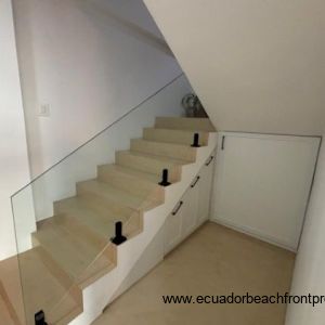 Stairway to 2nd level with storage cabinet