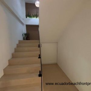 Stairway to 2nd level with storage cabinet