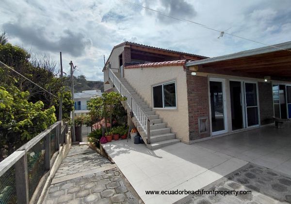 entrance to the 2nd level (main level) and the staircase leading to the 3rd level apartment