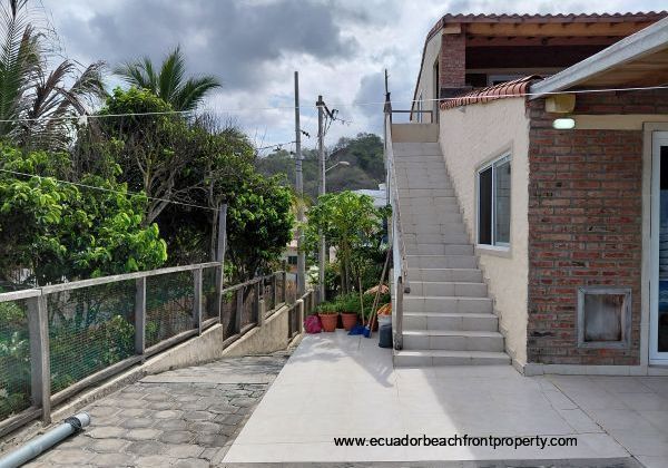 entrance to 2nd level (main level) and the staircase leading to the 3rd level apartment