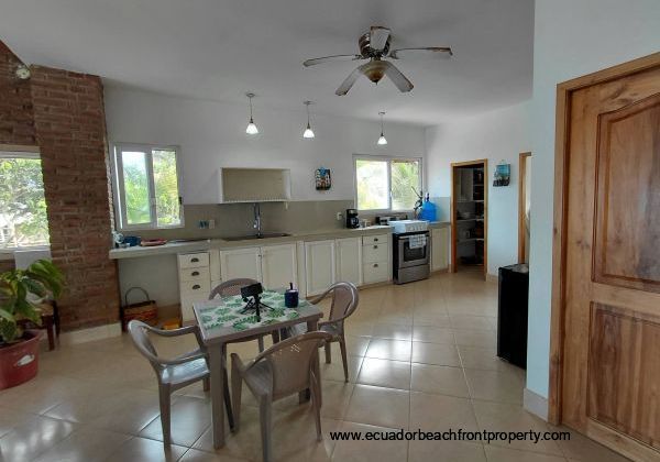 main level kitchen and living area off the oceanfront terrace 