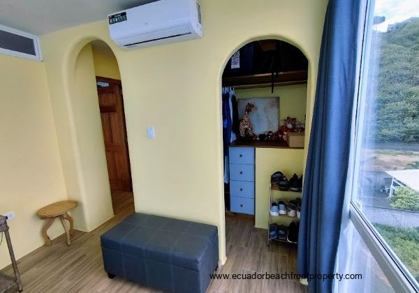The bedroom has a large closet and a mini-split air conditioning system.