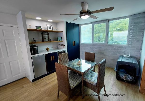 A recently renovated and functional dining area with beautiful lighting fixtures. This area is perfectly designed for easy entertaining or a peaceful paradise!