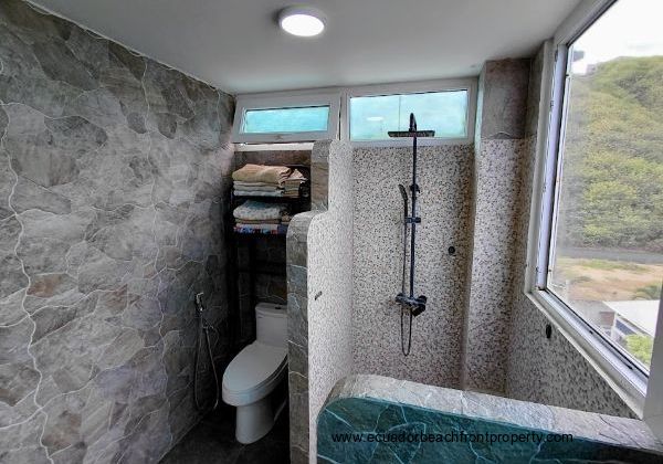 The principal bathroom has a cascading showerhead for both luxury and functionality.