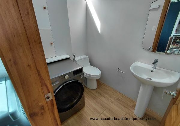 The half bathroom comes equipped with a washer/dryer combo. This can easily be moved to the principal bath and the shower reinstalled if 2 full baths are needed.